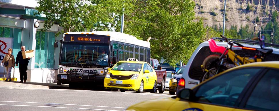 BC Transit bus waiting at a traffic light in downtown Prince George.