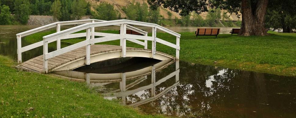 A flooded bridge at Paddlewheel Park during the spring.