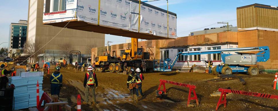 Construction crews working on a building site in downtown Prince George.