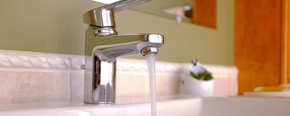 A running faucet in a bathroom